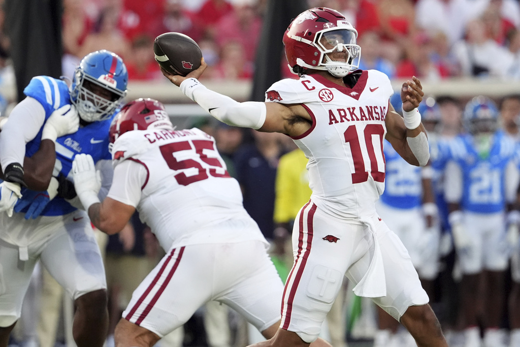 Arkansas quarterback Taylen Green (10) passes against Mississippi while Arkansas offensive lineman Fernando Carmona (55) provides protection during the first half of an NCAA college football game in Oxford, Miss., Saturday, Sept. 13, 2025. (AP Photo/Rogelio V. Solis)