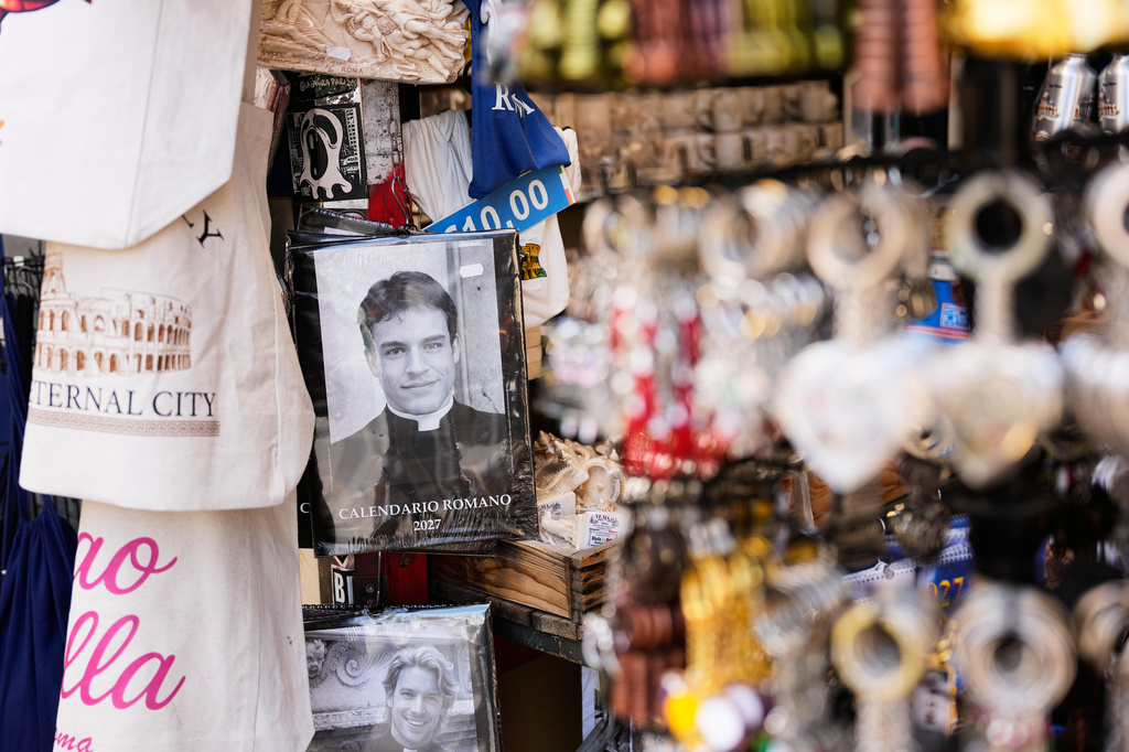 The 'Calendario Romano' calendar, bearing a photo of Giovanni Galizia, who is not a priest, is on sale in a souvenir shop in Rome, Wednesday, May 20, 2026. (AP Photo/Alessandra Tarantino)