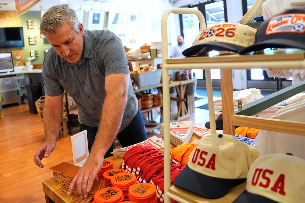 Made in Kansas City owner Keith Bradley has seen an influx of customers for his business as soccer fans have flocked to the city which is hosting FIFA World Cup soccer games Monday, June 29, 2026, in Kansas City, Mo. (AP Photo/Charlie Riedel) CORRECTS STATE TO MISSOURI FROM KANSAS