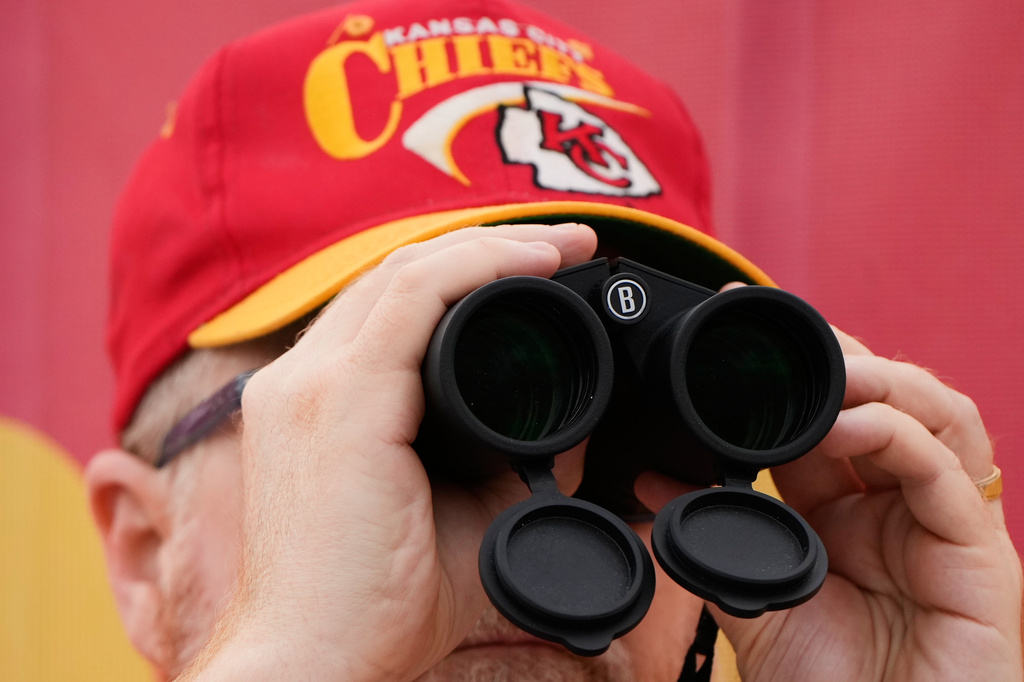 A fans watches during the Kansas City Chiefs' NFL football training camp Saturday, Aug. 1, 2026, in St. Joseph, Mo. (AP Photo/Charlie Riedel)