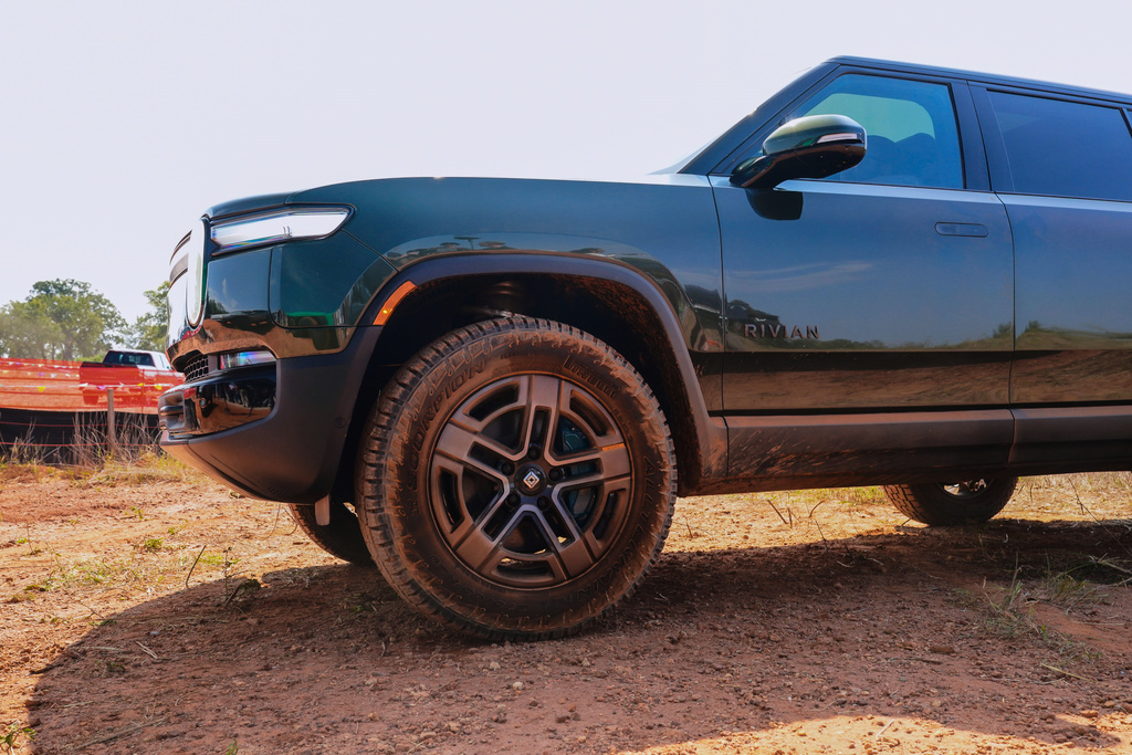 A Rivian R1S prepares to take a test drive on an off road course at the site of the electric vehicle's future manufacturing plant outside of Social Circle, Ga, Tuesday, Sept. 16, 2025. (Matthew Pearson/WABE via AP)