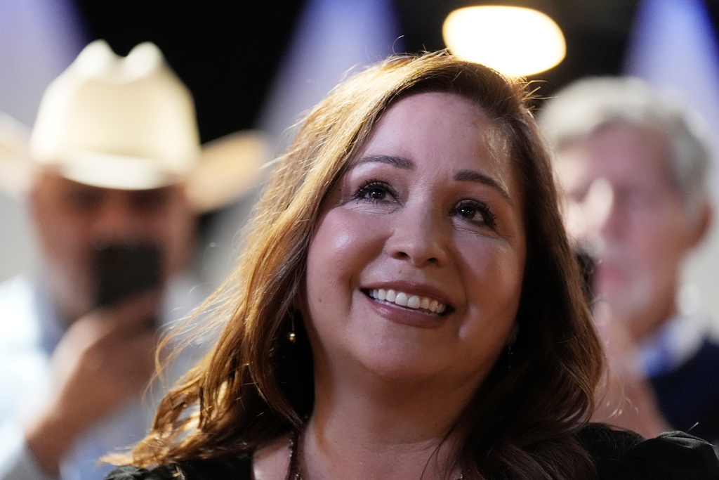 FILE - Arizona Democratic candidate Adelita Grijalva listens to her children speak at the stage podium after being declared the winner against Republican Daniel Butierez, to fill the Congressional District 7 seat held by the late Rep. Raúl Grijalva in a special election Sept. 23, 2025, in Tucson, Ariz. (AP Photo/Ross D. Franklin, File)