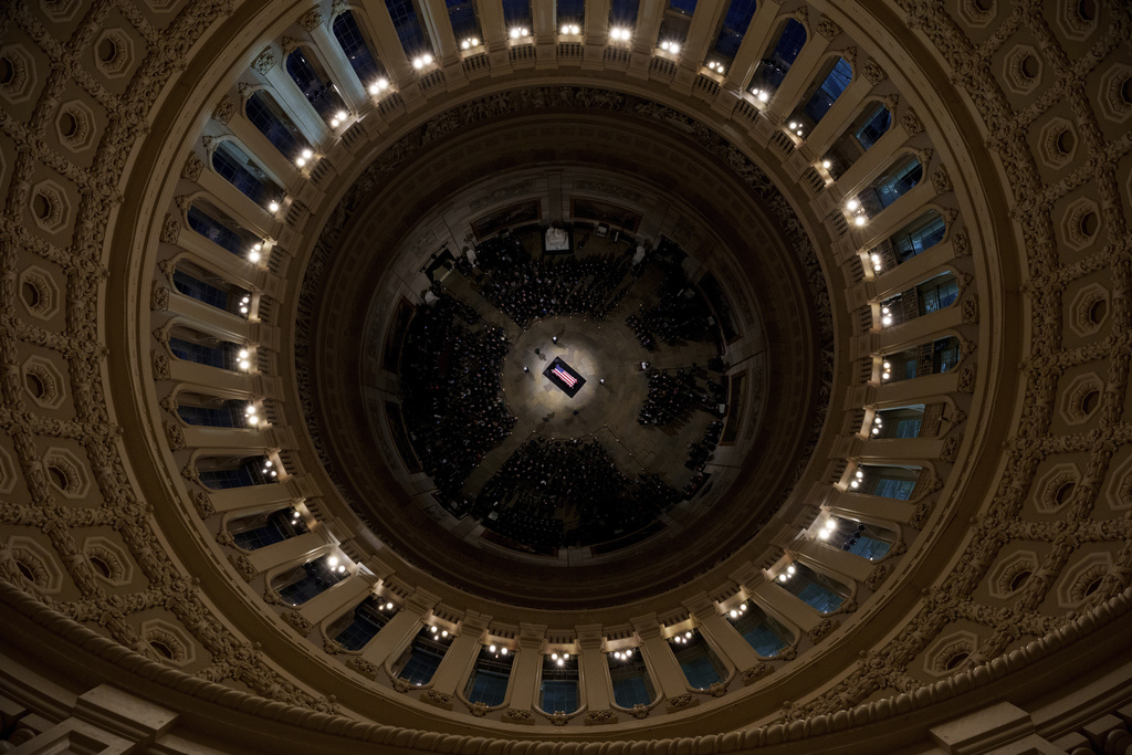 The flag-draped casket of former President Jimmy Carter lies in state at the rotunda of the U.S. Capitol Tuesday, Jan. 7, 2025, in Washington. (Andrew Harnik/Pool via AP)