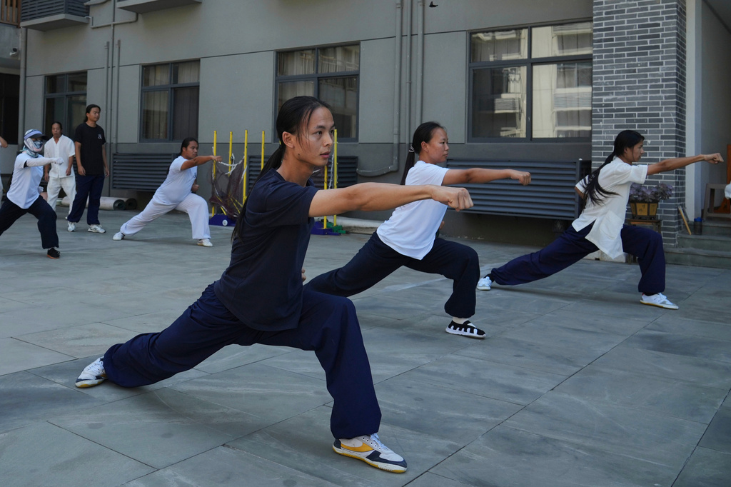 Students practice at the Wudang Taoist Traditional Kung Fu Academy near Wudang Mountain in Shiyan city in central China's Hubei province on Friday, Sept. 4, 2026. (AP Photo/Achmad Ibrahim)