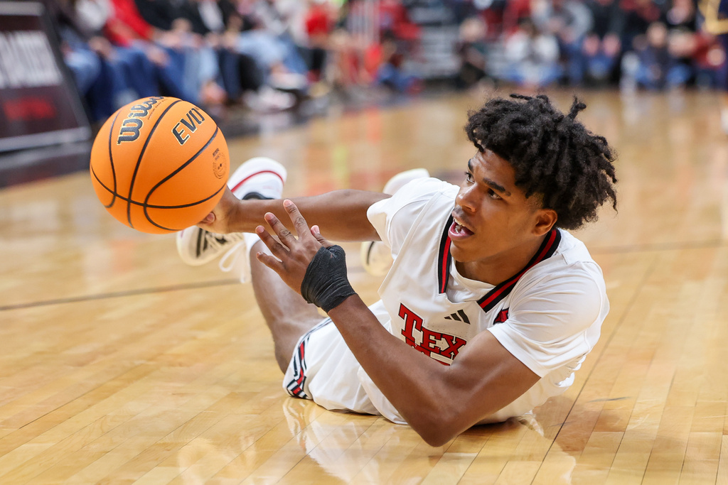 Texas Tech guard Christian Anderson (4) passes the ball from the floor during the second half of an NCAA college basketball game against Northern Colorado, Tuesday, Dec. 16, 2025, in Lubbock, Texas. (AP Photo/Chase Seabolt)