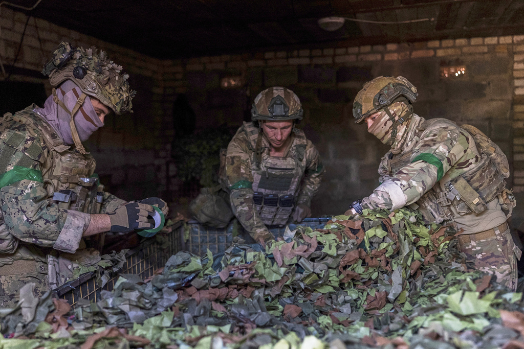 Ukrainian servicemen prepare an autonomous vehicle before it is sent to the front line near Kostiantynivka, Ukraine, on Wednesday, Sept. 10, 2025. (AP Photo/Alex Babenko)