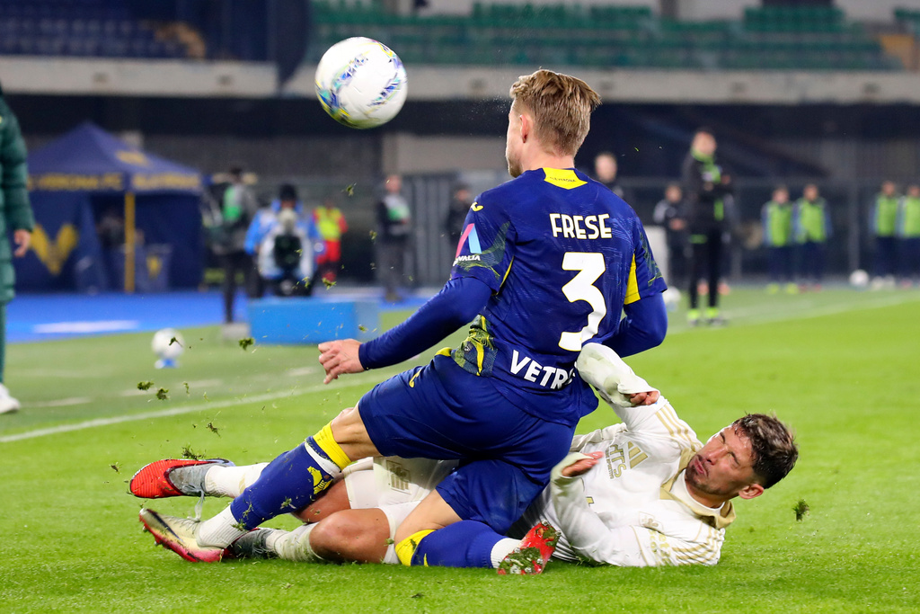 Pisa's Felipe Loyola, bottom, Verona's Martin Frese battle for the ball during the Serie A soccer match between Hellas Verona and Pisa, Friday, Feb. 6 , 2026, in Verona, Italy. (Paola Garbuio/LaPresse via AP)