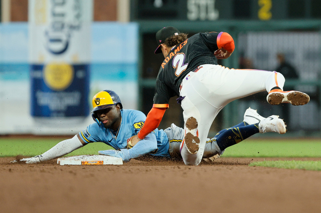 Milwaukee Brewers' Luis Lara (18) is caught stealing and tagged out by San Francisco Giants shortstop Willy Adames (2) in the fifth inning during baseball game in San Francisco, Tuesday, July 28, 2026. (Santiago Mejia/San Francisco Chronicle via AP)