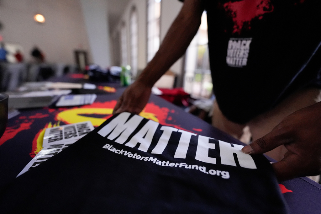 Nicholas Burns prepares his table at Bridgepointe Church during an event Wednesday, Sept. 16, 2026, in Marietta, Ga. (AP Photo/Mike Stewart)