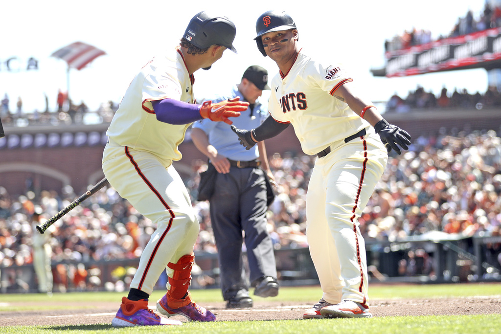 San Francisco Giants' Rafael Devers and Willy Adames celebrate Devers' home run during the first inning of a baseball game against the Baltimore Orioles at Oracle Park in San Francisco on Sunday, Aug. 31, 2025. (Scott Strazzante/San Francisco Chronicle via AP)