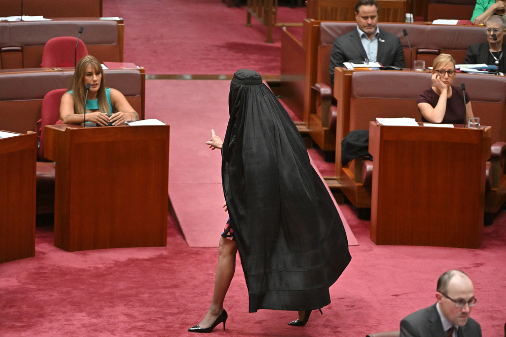 One Nation Leader Pauline Hanson wears a burqa in the Senate chamber at Parliament House in Canberra, Monday, Nov. 24, 2025. (Mick Tsikas/AAP Image via AP)