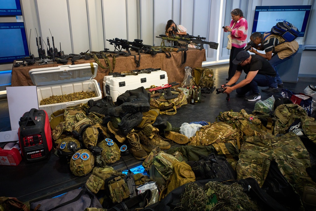 Weapons that Cuban authorities say were recovered from a speedboat in Cuban waters following a confrontation that left four people dead are displayed during a media presentation in Havana, Friday, Feb. 27, 2026. (AP Photo/Ramon Espinosa)
