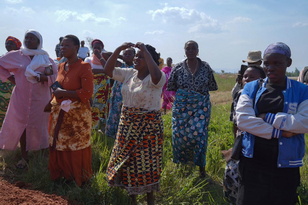 Women weep as they attend the burial ceremony of Neema Minaro, a 66 year old woman who died of the Ebola virus, in Bunia, Congo, Wednesday, Sept. 2, 2026. (AP Photo/Dieudonne Dirole)