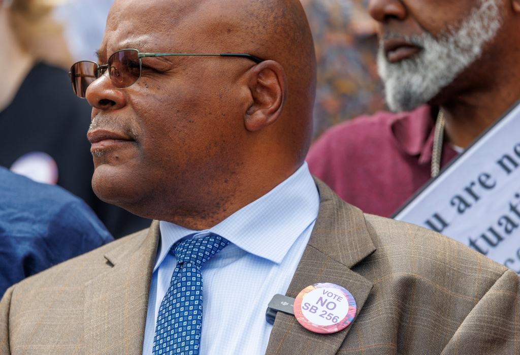 FILE - Calvin Duncan, wearing a button signifying his disagreement with Louisiana Senate Bill 256, is sworn-in as the new clerk on April 21, 2026 on the steps of the Orleans Parish Criminal District Courthouse in New Orleans. (Chris Granger/The Times-Picayune/The New Orleans Advocate via AP)