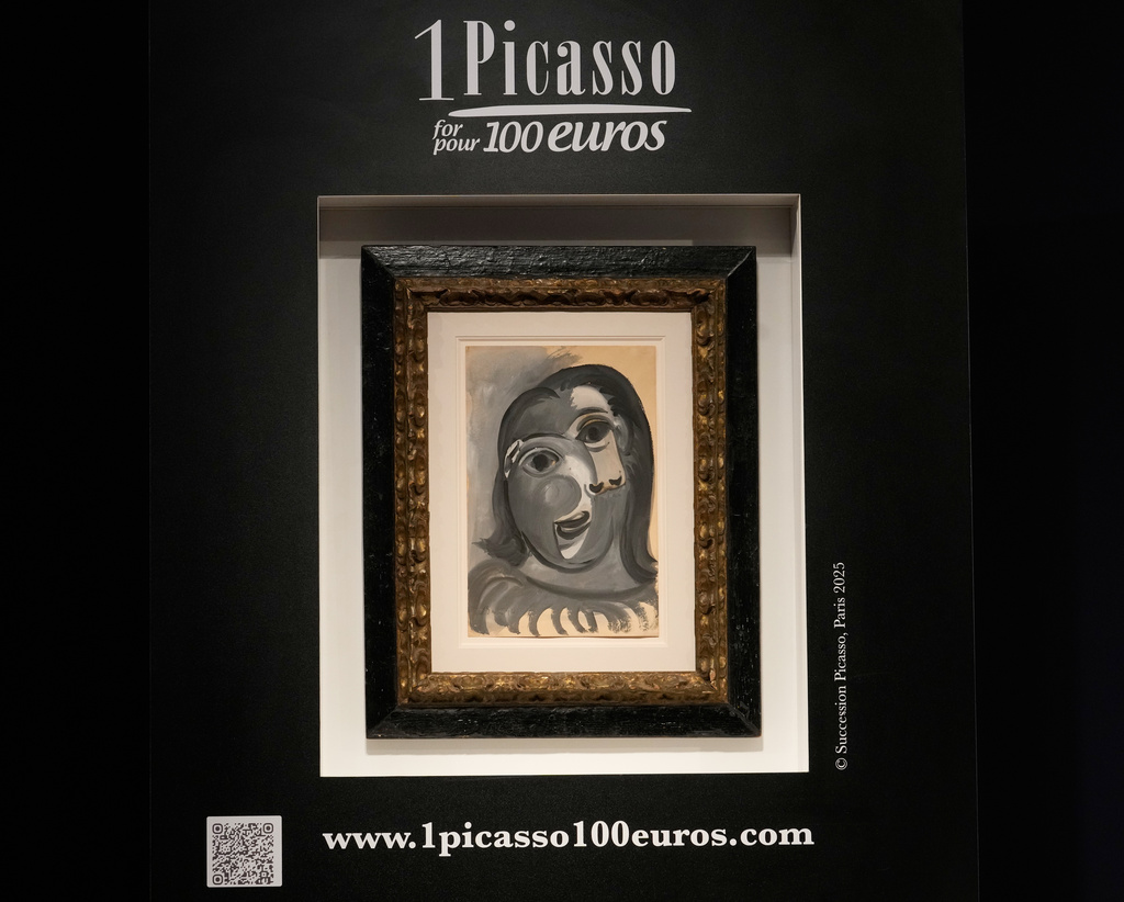 The painting 'Head of a Woman' by Pablo Picasso, painted in 1941, is presented prior to the raffle draw at the auction house Christie's in Paris, Tuesday, April 14, 2026. (AP Photo/Michel Euler)