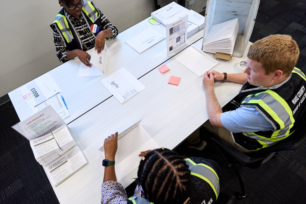 Wake County Board of Elections employees prepare absentee ballots to be mailed on Thursday, Sept. 3, 2026, in Raleigh, N.C. (AP Photo/Matt Ramey)
