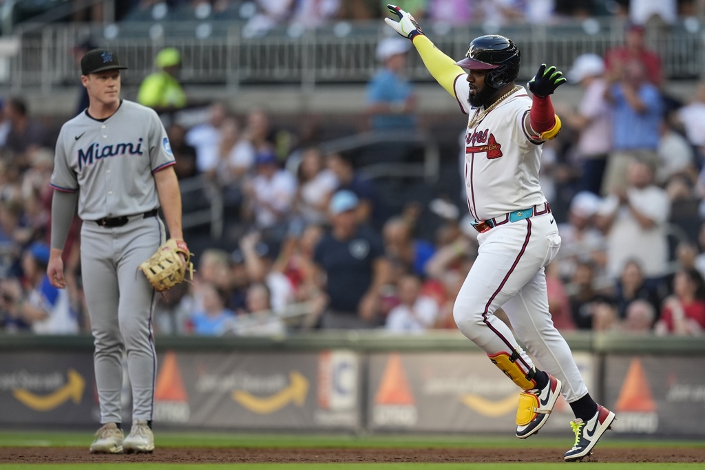 Atlanta Braves designated hitter Marcell Ozuna (20) celebrates his solo homer against the Miami Marlins in the first inning of a baseball game, Thursday, Aug. 7, 2025, in Atlanta. (AP Photo/Mike Stewart)
