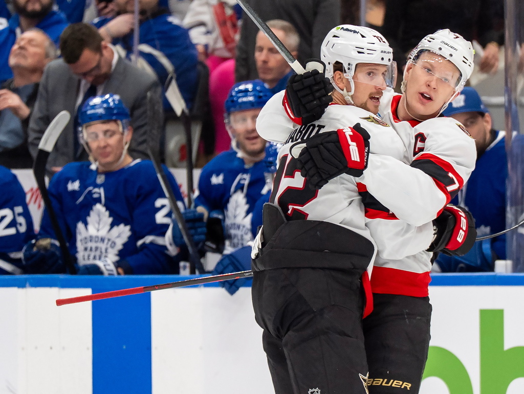 Ottawa Senators defenseman Thomas Chabot (72) celebrates after his goal with teammate Brady Tkachuk (7) during first-period NHL hockey game action against the Toronto Maple Leafs in Toronto, Saturday, Feb 28, 2026. (Frank Gunn/The Canadian Press via AP)