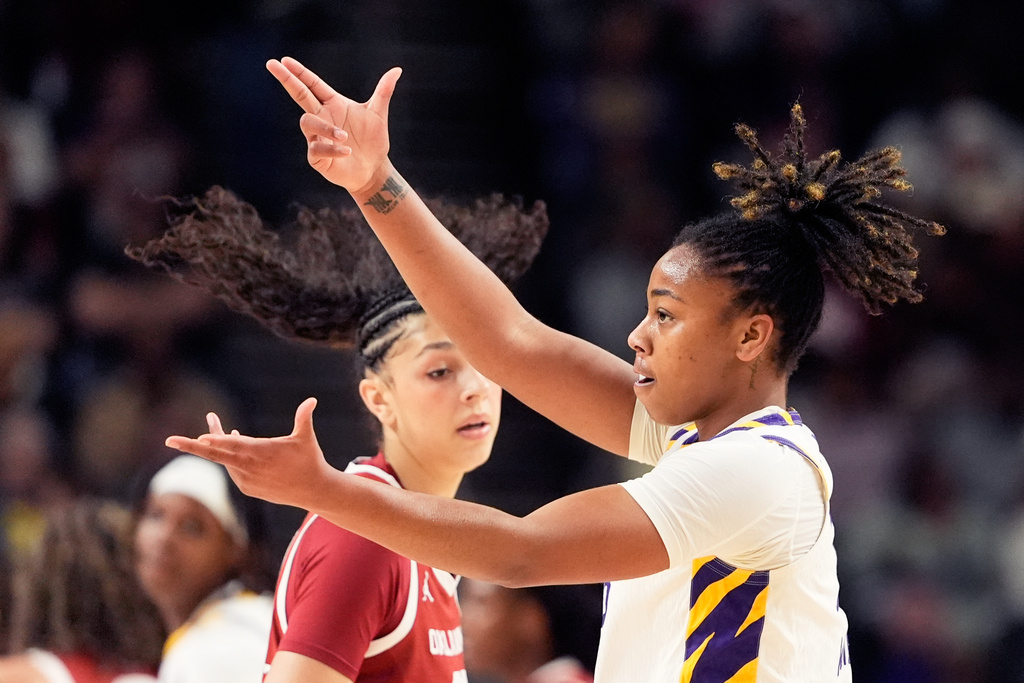 LSU guard Mikaylah Williams celebrates after scoring against Oklahoma during first half of an NCAA college basketball game in the quarterfinals of the Southeastern Conference tournament, Friday, March 6, 2026, in Greenville, S.C. (AP Photo/Chris Carlson)