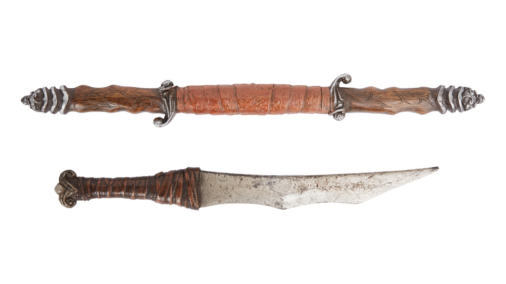 This combo of images provided by Julien's Auctions shows, Dark Crystal Gurjin Dagger and Baton Props, part of more than 400 props, costumes and set pieces from Muppets creator Jim Henson’s extensive career will go up for auction this fall. (Julien's Auctions via AP)