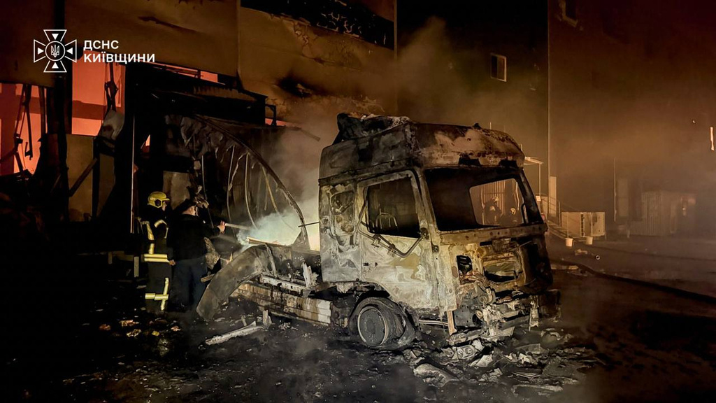 In this photo provided by the Ukrainian Emergency Service, firefighters put out a fire in a warehouse following a Russian drone attack near Kyiv, Ukraine, Wednesday, Sept. 2, 2026. (Ukrainian Emergency Service via AP)