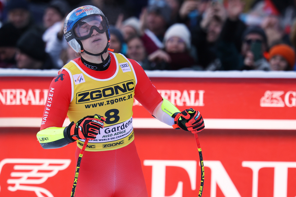 Switzerland's Marco Odermatt at the finish area of an alpine ski, men's World Cup super-G, in Val Gardena, France, Friday, Dec.19, 2025. (AP Photo/Alessandro Trovati)