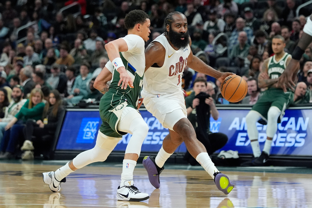 Cleveland Cavaliers' James Harden (1) drives to the basket against Milwaukee Bucks' Ryan Rollins during the first half of an NBA basketball game, Tuesday, March 17, 2026, in Milwaukee. (AP Photo/Aaron Gash)