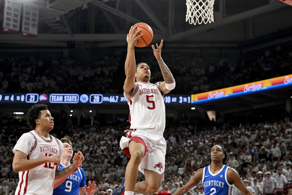 Arkansas guard Darius Acuff Jr. (5) goes up to score on a fast break against Kentucky during the first half of an NCAA college basketball game Saturday, Jan. 31, 2026, in Fayetteville, Ark. (AP Photo/Michael Woods)