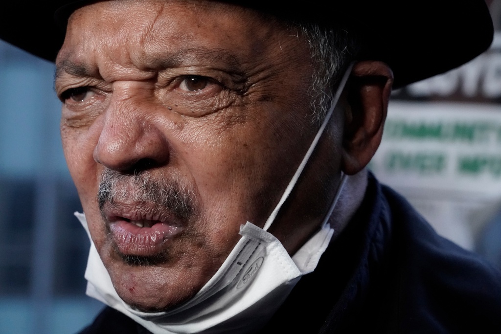 FILE - Rev. Jesse Jackson answers questions at a rally, April 19, 2021, in Minneapolis, as the murder trial against the former Minneapolis police Officer Derek Chauvin in the killing of George Floyd advances to jury deliberations. (AP Photo/Morry Gash, File)