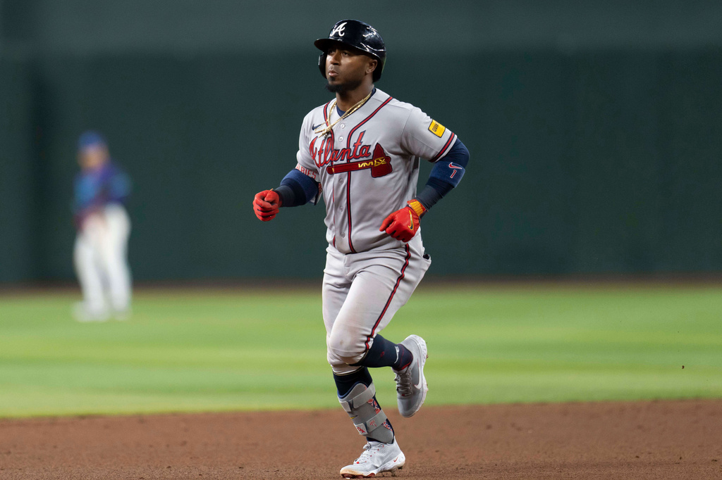 Atlanta Braves second baseman Ozzie Albies (1) rounds the bases after hitting a home run during the ninth inning of a baseball game against the Arizona Diamondbacks, Friday, April 3, 2026, in Phoenix. (AP Photo/Rebecca Noble)