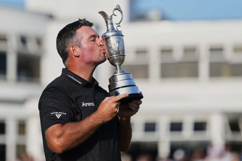 Ryan Fox of New Zealand poses with the Claret Jug trophy in front of the club house, after winning the British Open Golf championships at Royal Birkdale golf club, in Southport, England, Sunday, July 19, 2026. (AP Photo/Jon Super)
