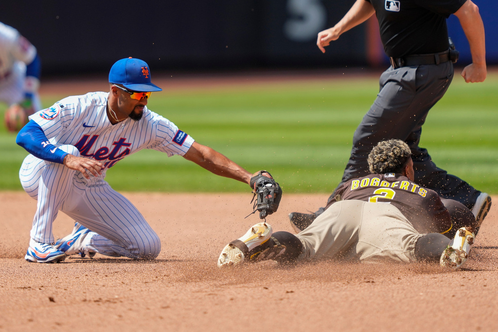 San Diego Padres' Xander Bogaerts (2) dives into second base after hitting a double during the fifth inning of a baseball game against the New York Mets, Wednesday, Aug. 19, 2026, in New York. (AP Photo/Yuki Iwamura)