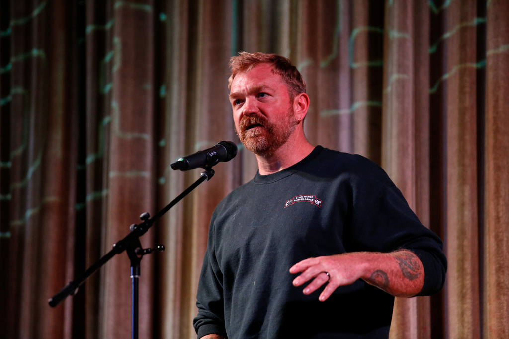 FILE - Democratic Maine Senate candidate Graham Platner speaks at a town hall in Ogunquit, Maine, Oct. 22, 2025. (AP Photo/Caleb Jones, File)