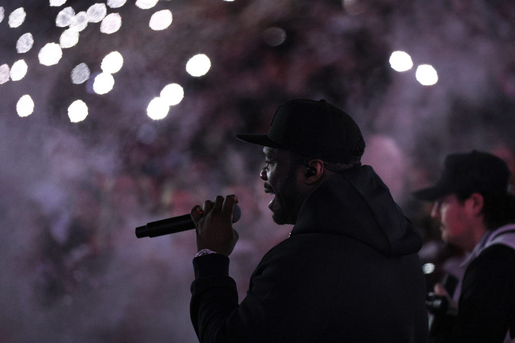 Rapper and actor 50 Cent performs during the second half in the first round of an NCAA College Football Playoff between Alabama and Oklahoma, Friday, Dec. 19, 2025, in Norman, Okla. (AP Photo/Nate Billings)