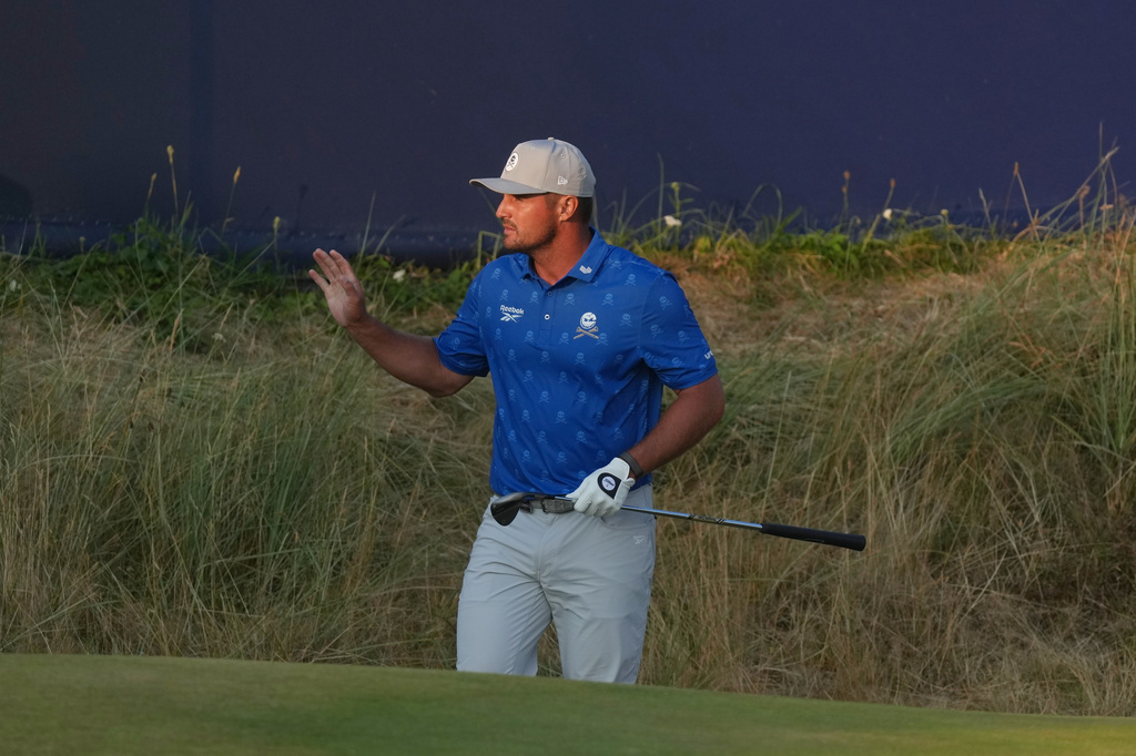 Bryson DeChambeau of the United States reacts after playing a shot on the 17th green during the second day of the British Open Golf championships at Royal Birkdale golf club, in Southport, England, Friday, July 17, 2026. (AP Photo/Jon Super)