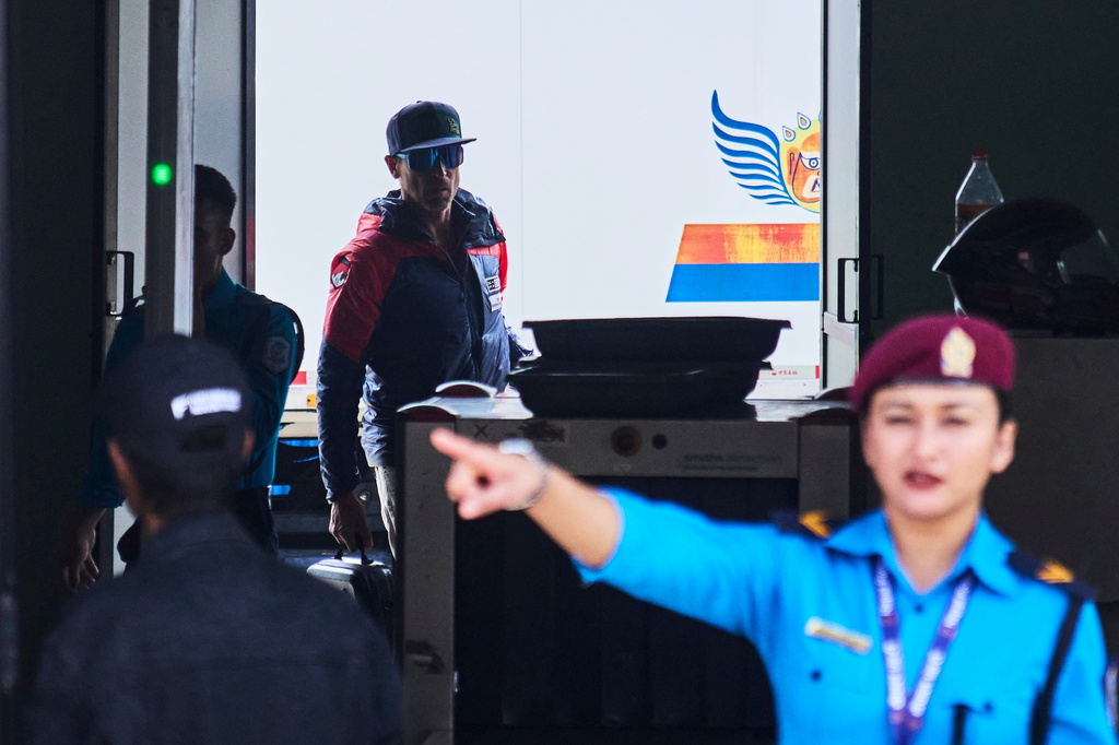 British mountain guide Kenton Cool, who scaled Mount Everest Sunday for the 20th time breaking his own record for the most ascents of the world's highest mountain by a non-Sherpa guide, arrives at the airport in Kathmandu, Nepal, Sunday, May 24, 2026. (AP Photo/Niranjan Shrestha)