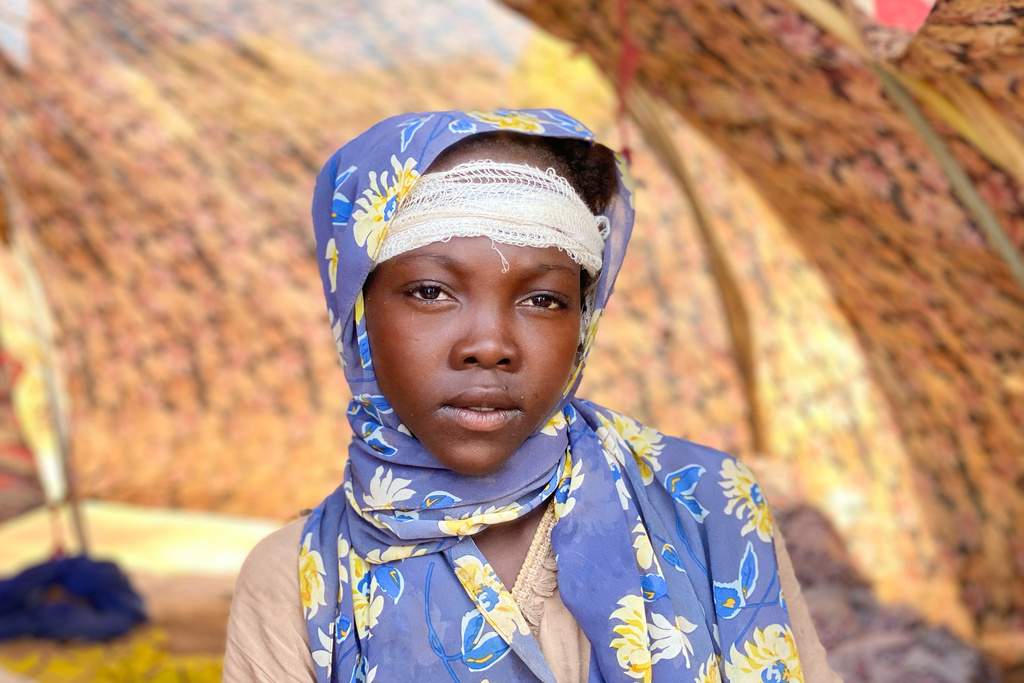 Khawater Mohammed, an injured Sudanese who fled el-Fasher city, after Sudan's paramilitary forces killed hundreds of people in the western Darfur region, receives medical care at a camp in Tawila, Sudan, Thursday, Oct. 30, 2025. (AP Photo/Mohammed Abaker)
