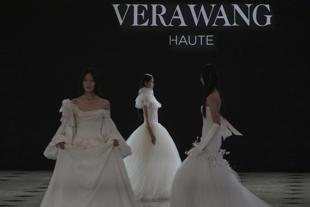 Models showcase the wedding dress creations by Vera Wang Haute collection during the SS2026 China Fashion Week, in Beijing, China, Wednesday, Sept. 10, 2025. (AP Photo/Andy Wong)