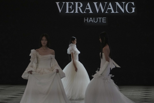 Models showcase the wedding dress creations by Vera Wang Haute collection during the SS2026 China Fashion Week, in Beijing, China, Wednesday, Sept. 10, 2025. (AP Photo/Andy Wong) Models showcase the wedding dress creations by Vera Wang Haute collection during the SS2026 China Fashion Week, in Beijing, China, Wednesday, Sept. 10, 2025. (AP Photo/Andy Wong)