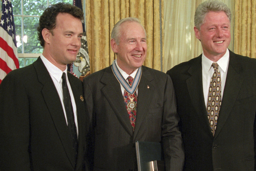 FILE - President Clinton stands with actor Tom Hanks, left, and former astronaut James Lovell in the Oval Office of the White House Wednesday, July 26, 1995, after presenting Lovell with the Congressional Space Medal of Honor. Hanks portrayed Lovell in the movie "Apollo 13." (AP Photo/Wilfredo Lee, File)