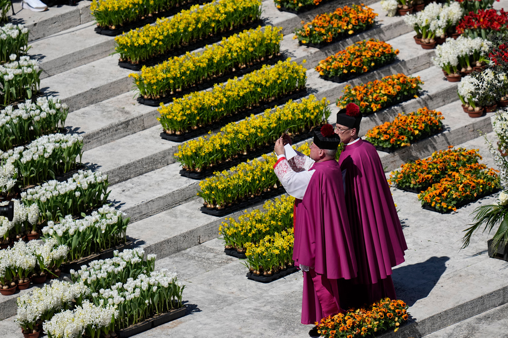 Pope Leo XIV delivers the Urbi et Orbi blessing - Latin for "to the city of Rome and to the world" - from the central loggia of St. Peter's Basilica at the end of Easter Mass he presided over in St. Peter's Square at the Vatican, Sunday, April 5, 2026. (AP Photo/Alessandra Tarantino)
