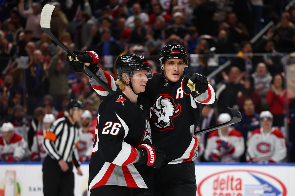 Buffalo Sabres center Tage Thompson, right, celebrates his goal with defenseman Rasmus Dahlin (26) during the first period of an NHL hockey game against the Montreal Canadiens, Thursday, Jan. 15, 2026, in Buffalo, N.Y. (AP Photo/Jeffrey T. Barnes)