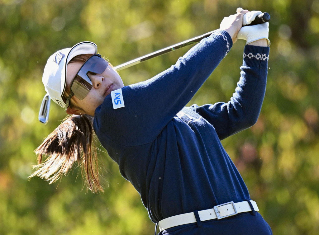 Japan's Yuna Araki plays a shot on the third round of the LPGA's Toto Japan Classic in Otsu, Shiga prefecture, Japan Saturday, Nov. 8, 2025. (Kyodo News via AP)