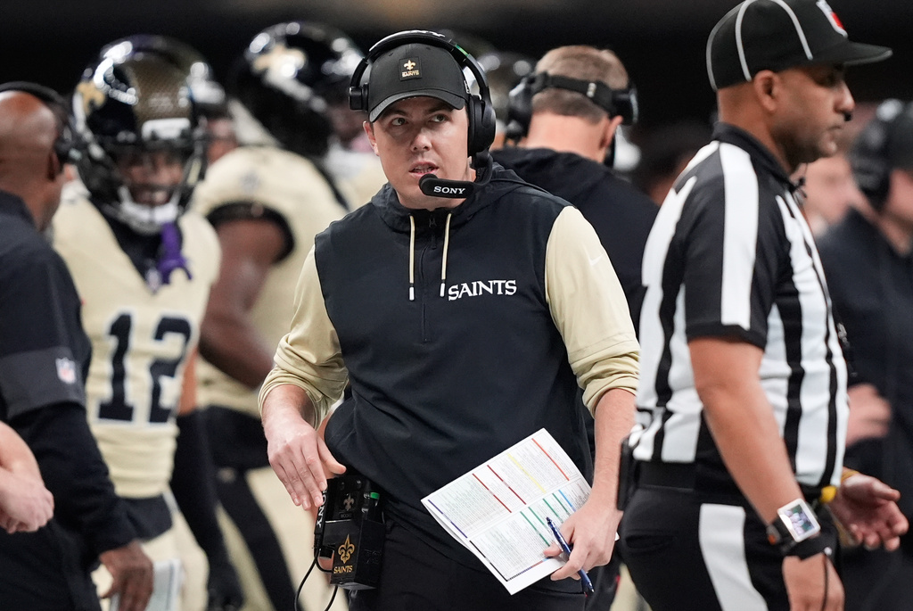 New Orleans Saints head coach Kellen Moore walks on the sideline during the first half of an NFL football game against the New York Jets, Sunday, Dec. 21, 2025, in New Orleans. (AP Photo/Gerald Herbert)