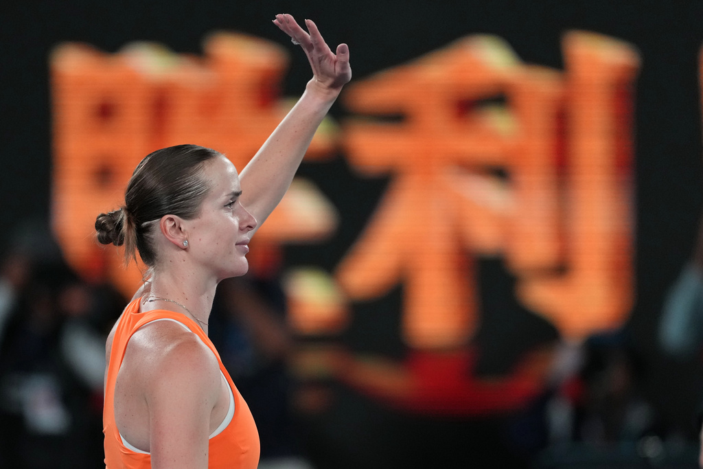 Elina Svitolina of Ukraine waves after defeating Coco Gauff of the U.S. in their quarterfinal match at the Australian Open tennis championship in Melbourne, Australia, Tuesday, Jan. 27, 2026. (AP Photo/Asanka Brendon Ratnayake)