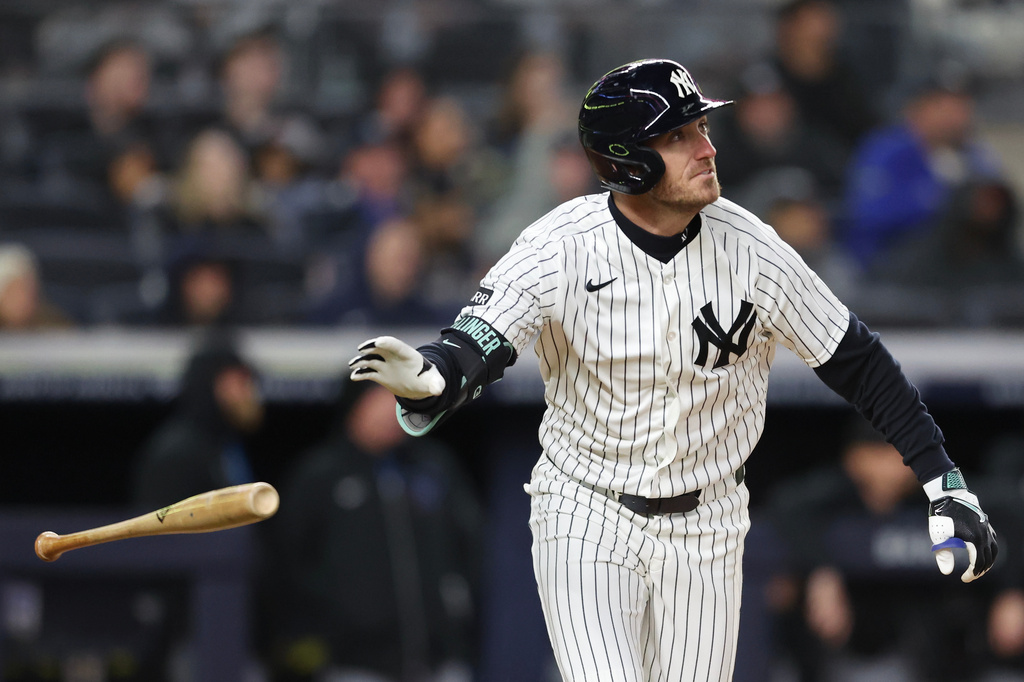 New York Yankees' Cody Bellinger tosses his bat after a home run during the fifth inning of a baseball game against the Miami Marlins, Saturday, April 4, 2026, in New York. (AP Photo/Heather Khalifa)