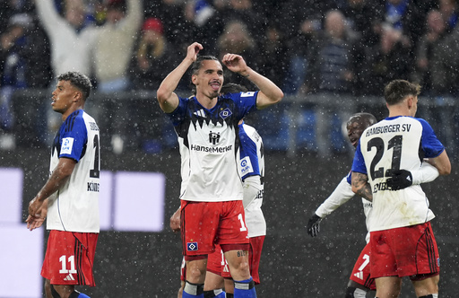 Hamburger's Rayan Philippe, center, celebrates scoring during the Bundesliga soccer match between Hamburger SV and FSV Mainz 05 at the Volksparkstadion, Hamburg, Germany, Sunday Oct. 5, 2025. (Marcus Brandt/dpa via AP) Hamburger's Rayan Philippe, center, celebrates scoring during the Bundesliga soccer match between Hamburger SV and FSV Mainz 05 at the Volksparkstadion, Hamburg, Germany, Sunday Oct. 5, 2025. (Marcus Brandt/dpa via AP)