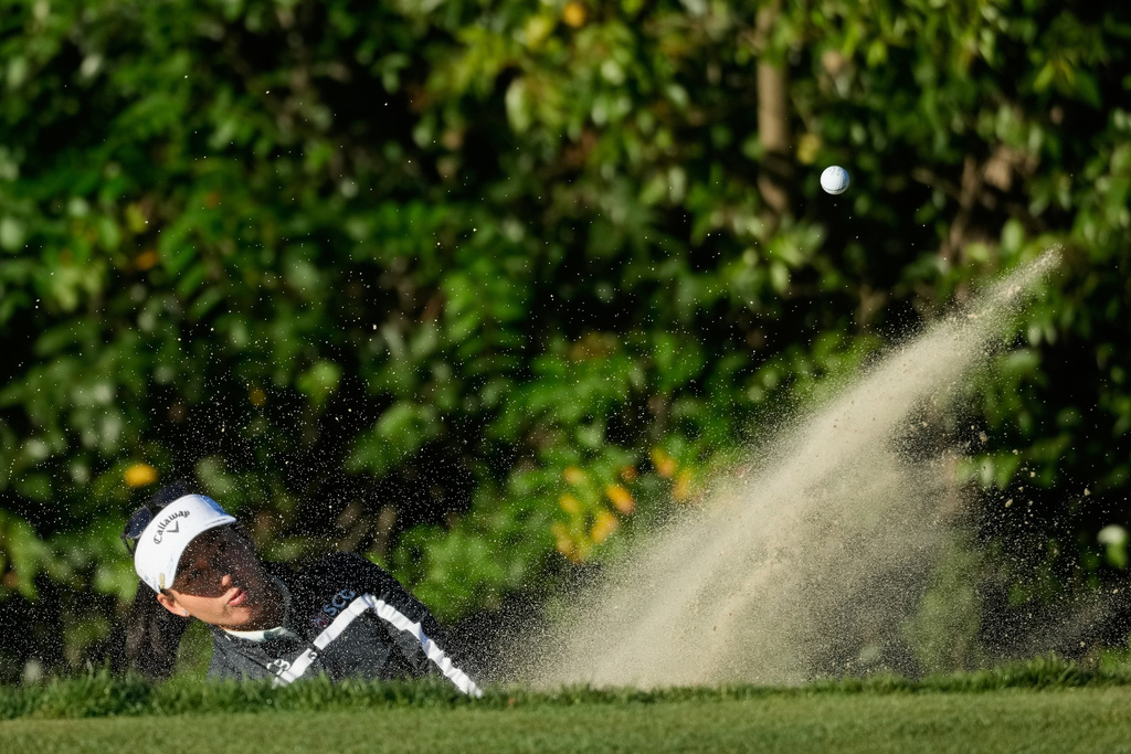 Jeeno Thitikul, of Thailand, hits from a bunker toward the 11th green during the first round of the LPGA Fortinet Founders Cup golf tournament, Thursday, March 19, 2026, in Menlo Park, Calif. (AP Photo/Jeff Chiu)