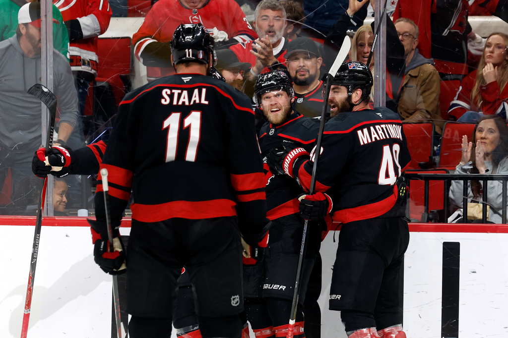 Carolina Hurricanes' Nikolaj Ehlers, second from right, celebrates after his goal against the Montreal Canadiens with teammates during the second period in Game 2 of the Eastern Conference final NHL hockey Stanley Cup playoff series in Raleigh, N.C., Saturday, May 23, 2026. (AP Photo/Karl DeBlaker)