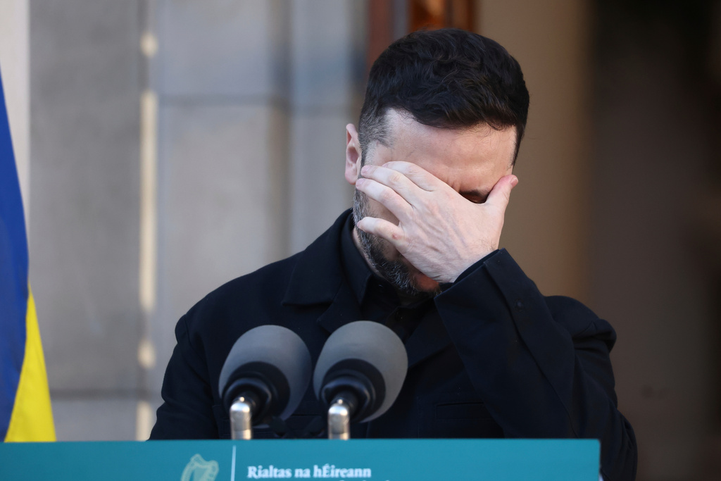 Ukraine's President Volodymyr Zelenskyy reacts as during a joint news conference with the Irish Taoiseach Micheal Martin in Dublin, Ireland, Tuesday, Dec. 2, 2025. (AP Photo/Peter Morrison)